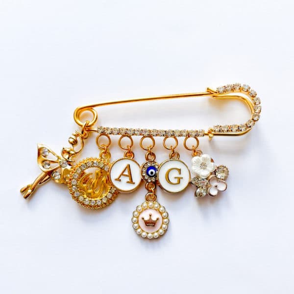 Strassnadel mit 7 Charms, gold