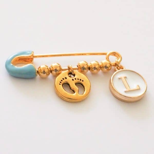 hellblaue Nadel mit 2 charms, gold